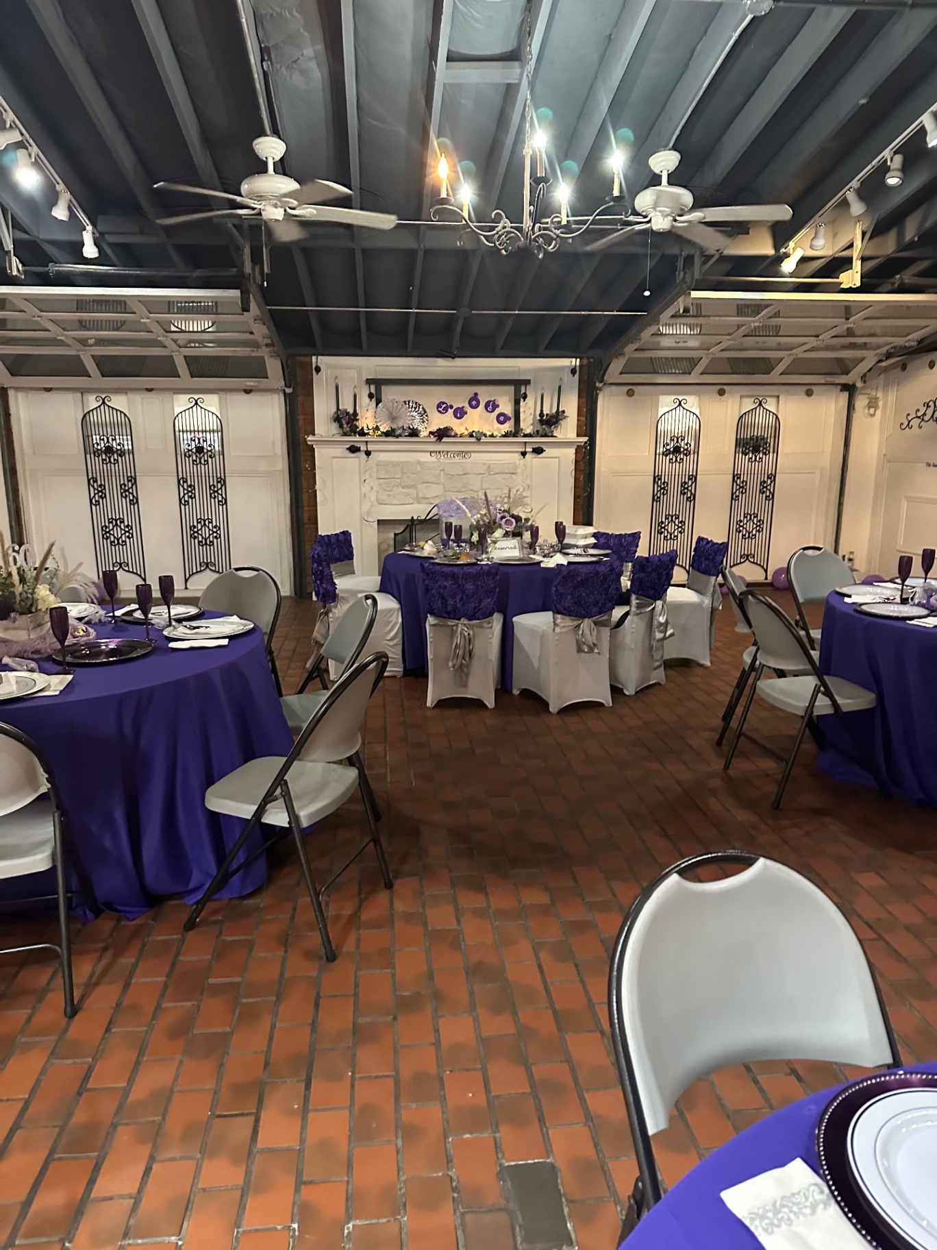 Elegant purple-themed event setup with round tables